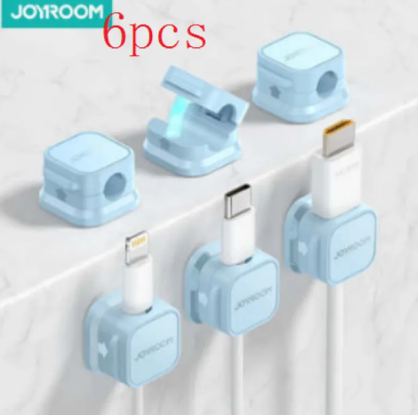 Black magnetic cable clips keeping desk cords tidy