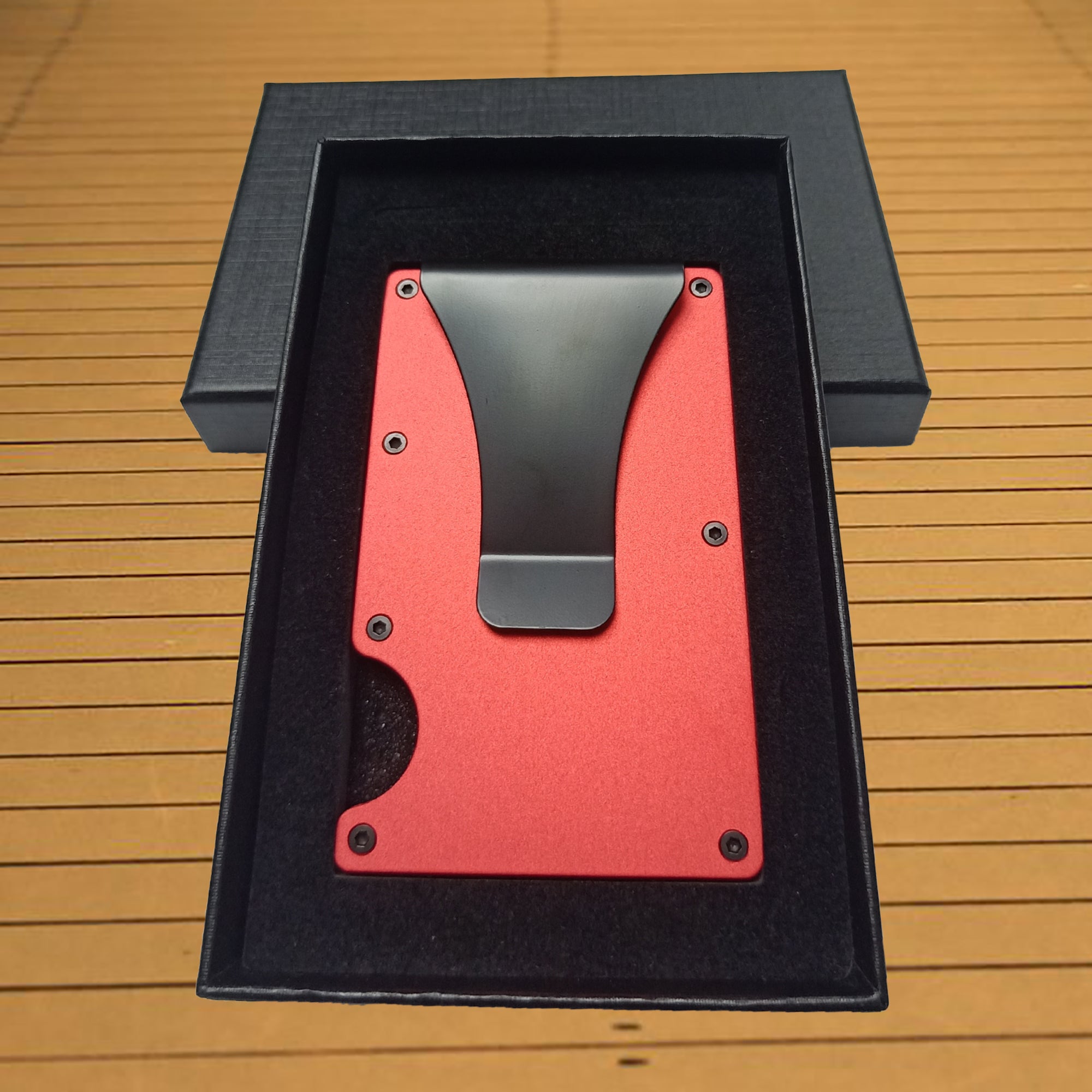 Minimalist metal money clip wallet holding cash and cards