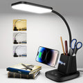 Black LED desk lamp with wireless charger on a home office desk